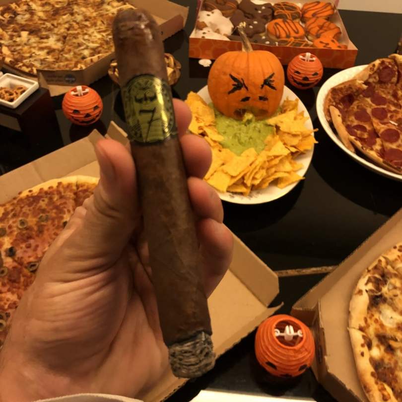 Chris Khatschadourian having an El Septimo cigar on Halloween