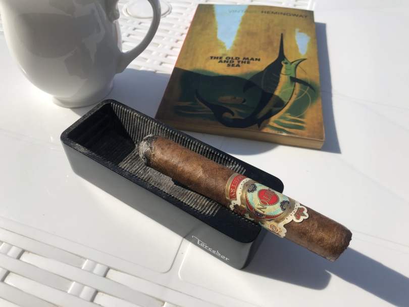 Smoking an Ashton Symmetry cigar while reading Hemingway's The Old Man and the Sea