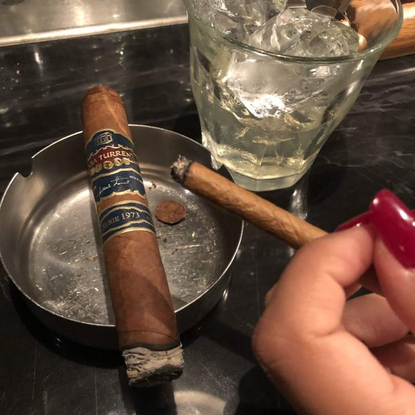 A Casa Turrent Serie 1973 cigar paired with Talisker Storm at a bar.