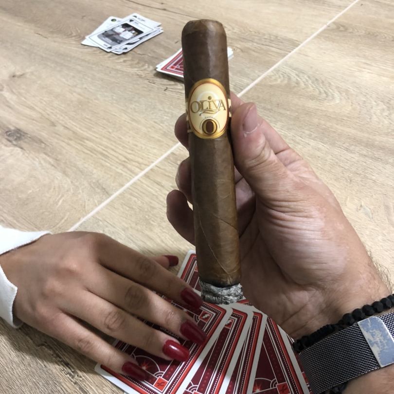 At a friend's place. Smoking an Oliva Serie O cigar while playing board games.