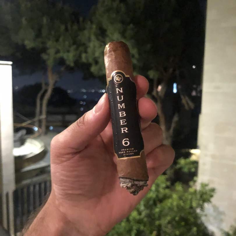 Chris Khatschadourian smoking a Rocky Patel Number 6 Toro