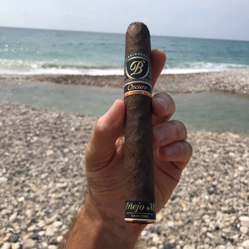 Chris Khatschadourian enjoying a cigar at the beach somewhere in Lebanon