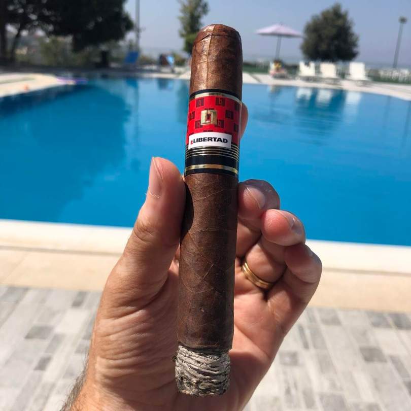 Smoking La Libertad Gran Toro cigar at Le Pave in Air Aar.
