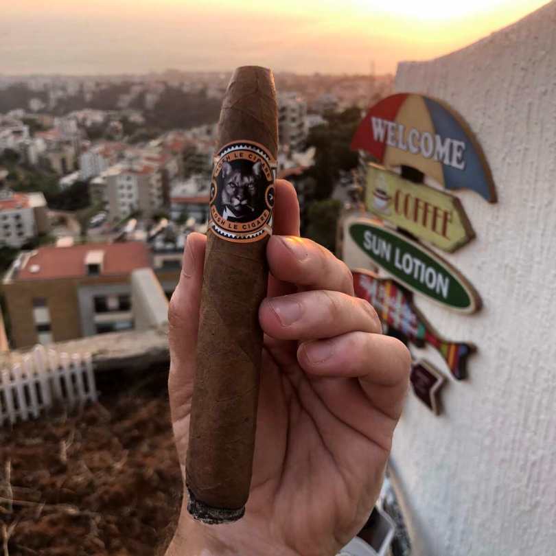 Smoking a Mosh Cigar, the Puma on the terrace. Somewhere in Lebanon.