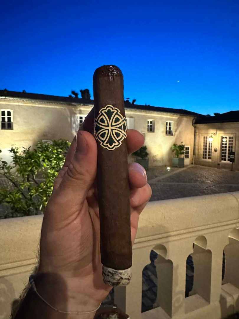 Smoking a cigar at Chateau Pape Clement in Pessac, Bordeaux.